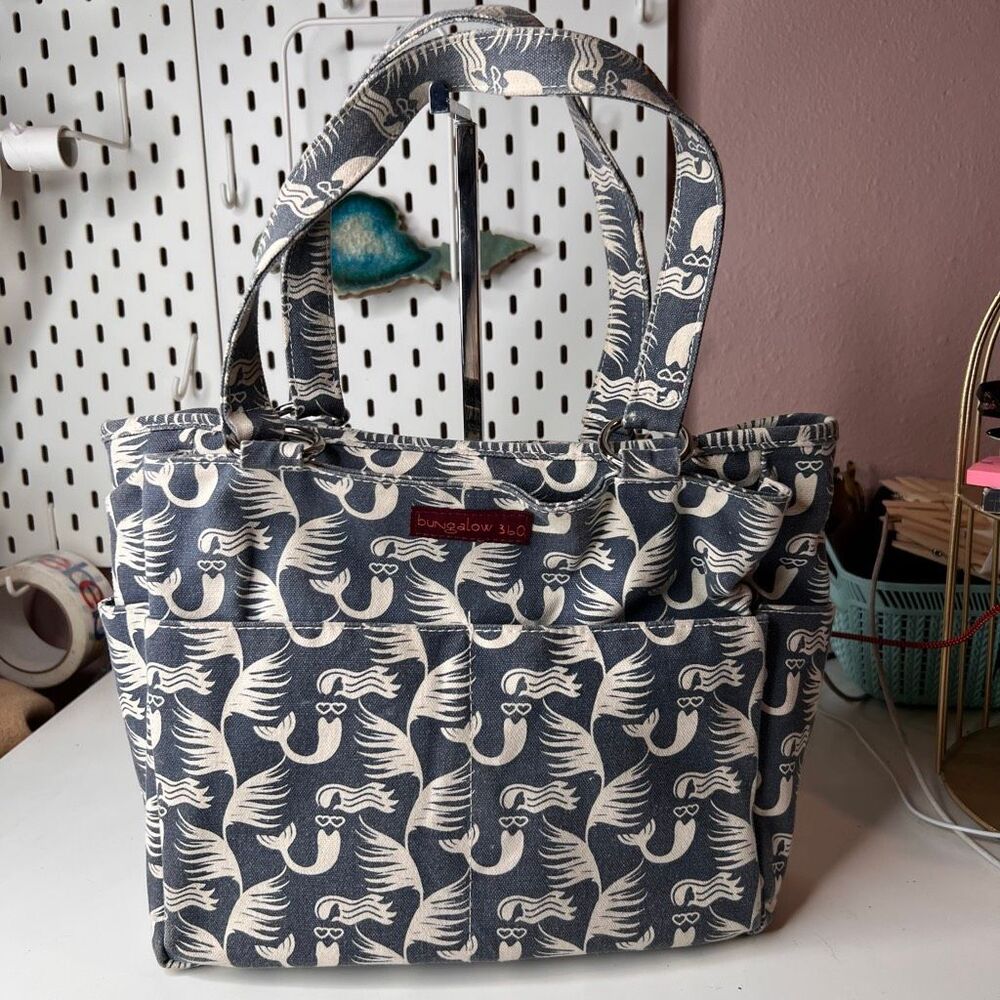 Bungalow360 Pocket Bag features a distinct mermaid print on durable canvas